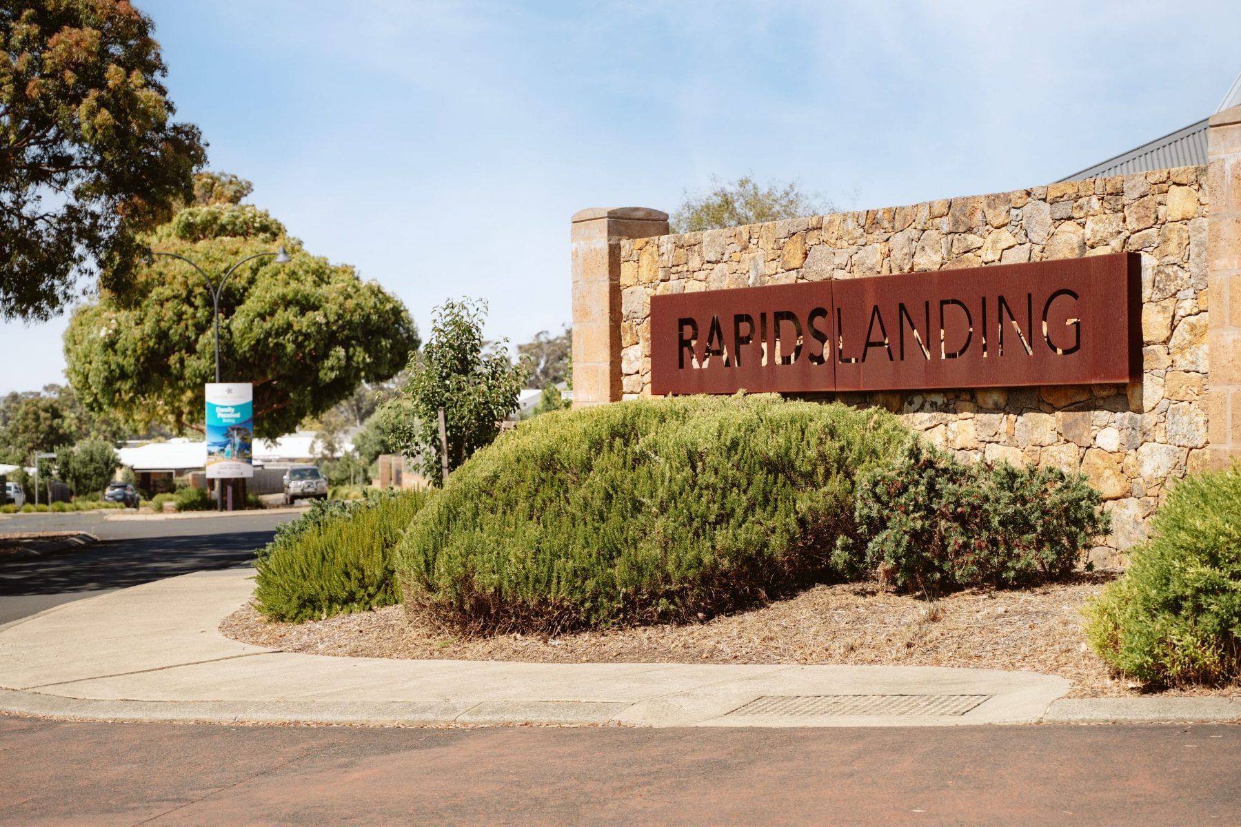 The landscaped entrance to Rapids Landing